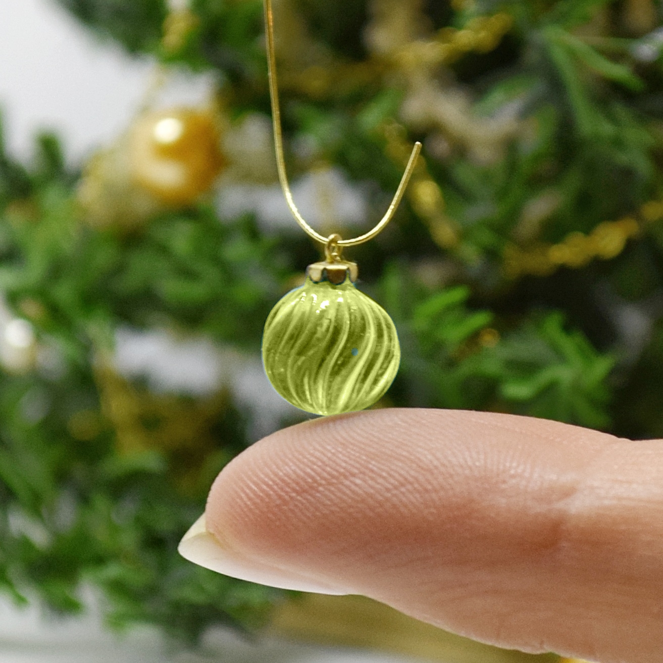 Xmas ornament. Painted. Bauble twisted green.