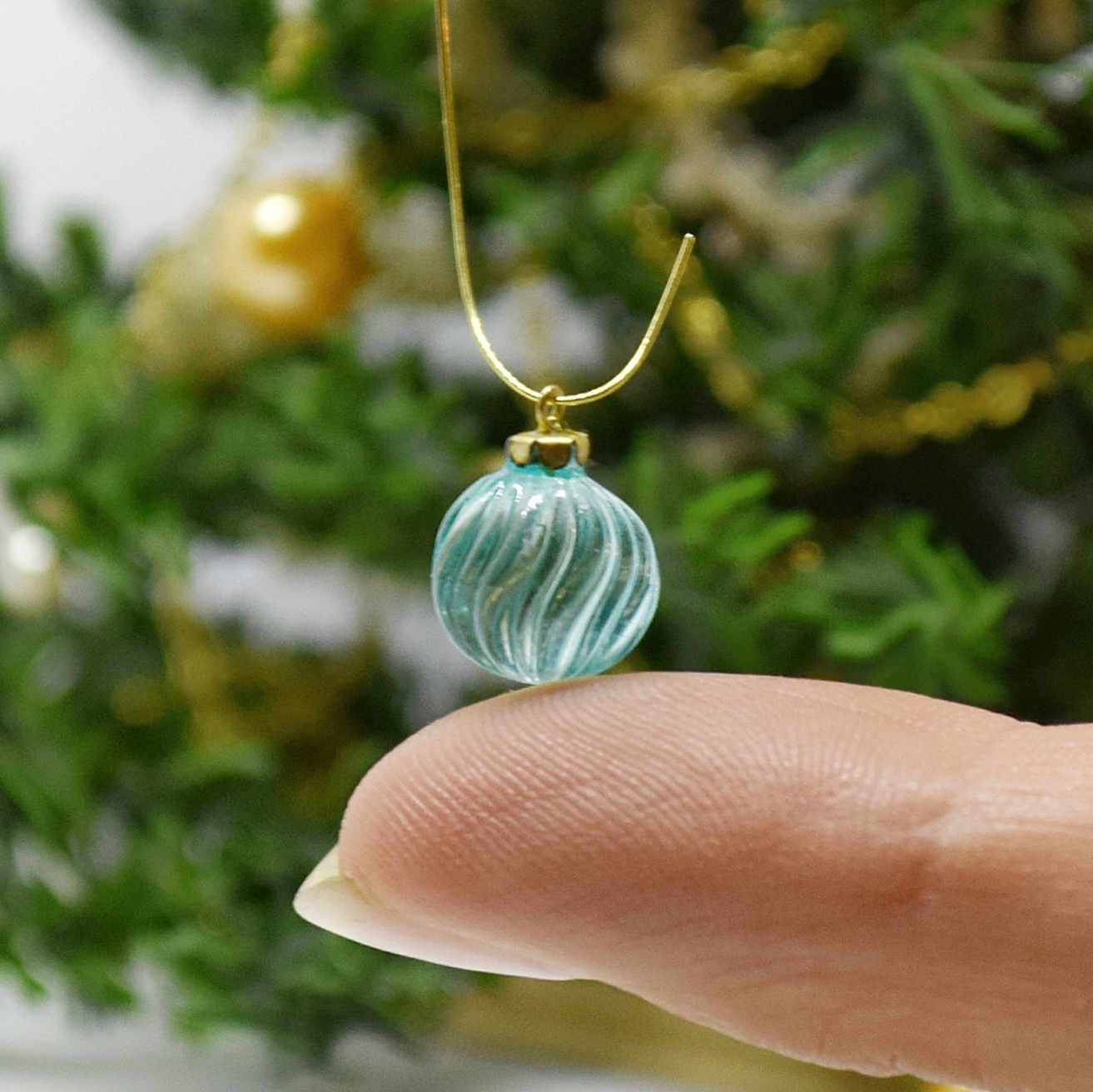 Xmas ornament. Painted. Bauble twisted blue.