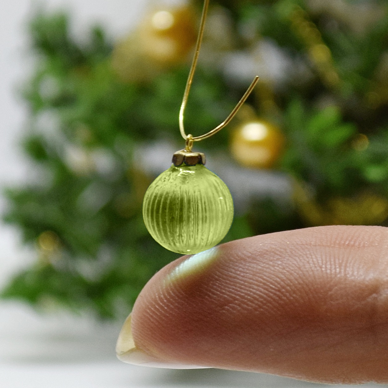 Xmas ornament. Painted. Bauble patterned green.