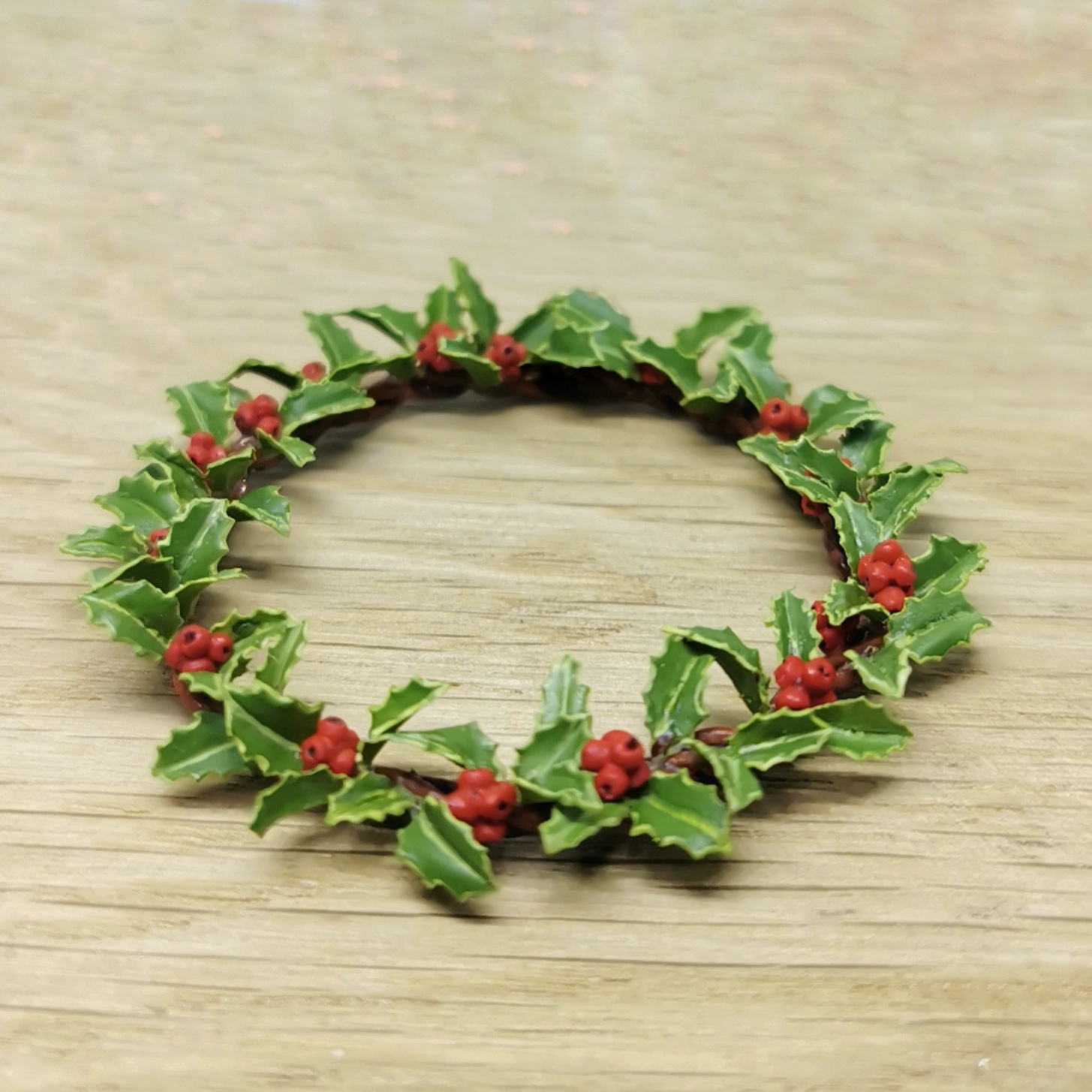 Holly plant decor. Symmetrical wreath.